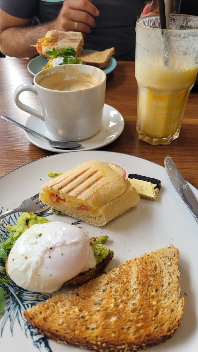 Poached eggs, panini and fresh juice